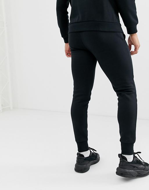 Puma Essentials small logo slim joggers in black