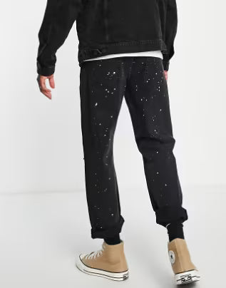 Rip And Paint Splat Relaxed Jeans In Washed Black