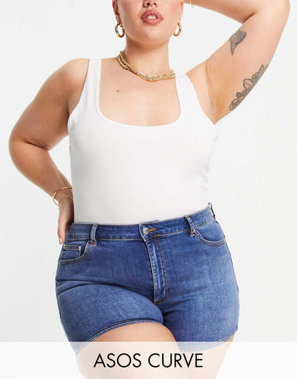 ASOS DESIGN Curve denim high rise 'lift and contour' shorts in midwash