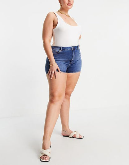 ASOS DESIGN Curve denim high rise 'lift and contour' shorts in midwash