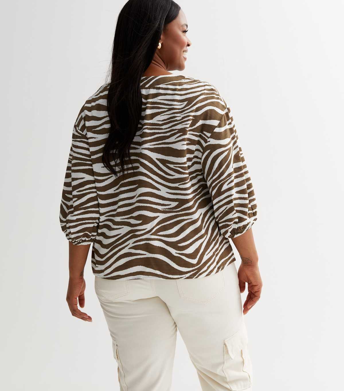 Curves Olive Zebra Print V Neck Top